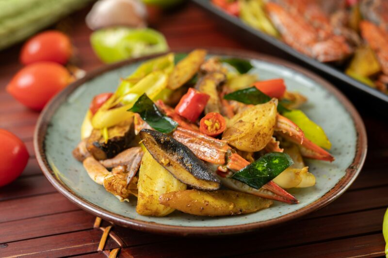 Stir-fried crab with curry powder in a plate.