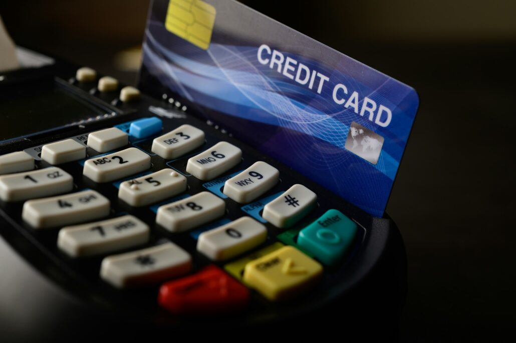 Swipe credit cards in stores to pay for goods and services.