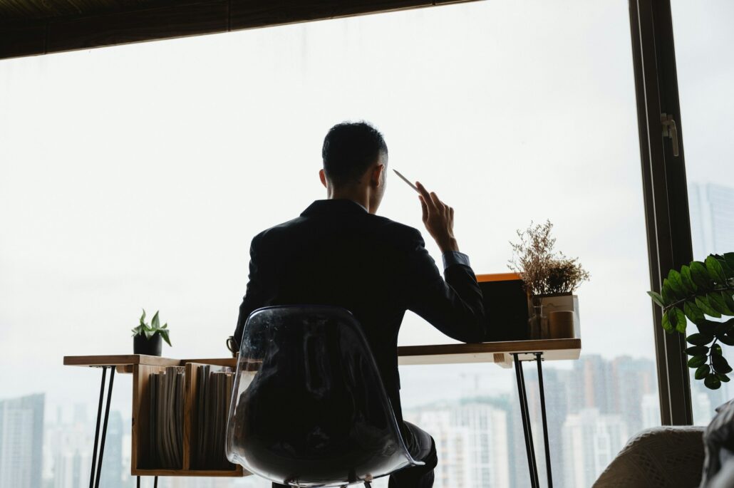 The businessman is stressed by economic problems.