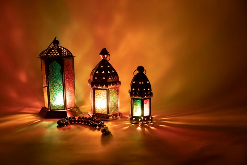 Three Arabic lantern with prayer beads in orange color for Ramadan, Eid, Islamic new year