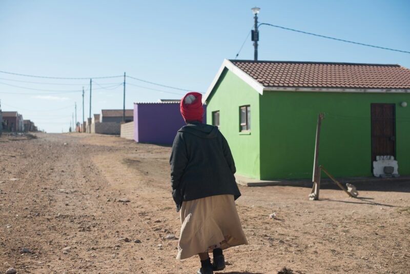 Woman seen walking in a township in south africa