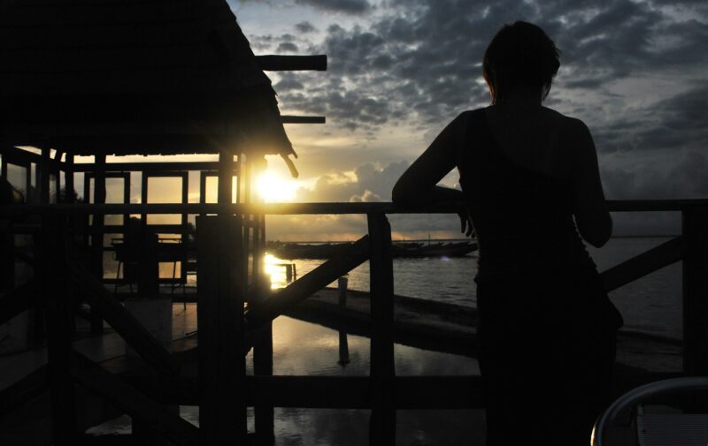 Woman watching sunset in Senegal