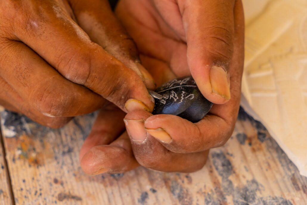 Writing in Egyptian hieroglyphic writing on a black alabaster scarab at Luxor. Egypt